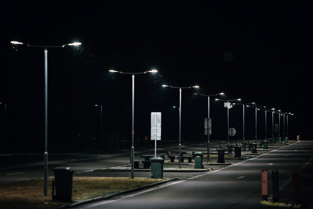 Street Lights In An Empty Lot At Nighttime